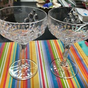 2 Crystal champagne glasses.